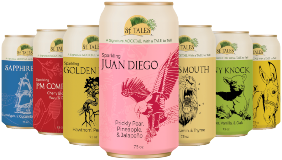 Seven St. Tales mocktail cans form a lineup, with the pink Juan Diego can centered in front.